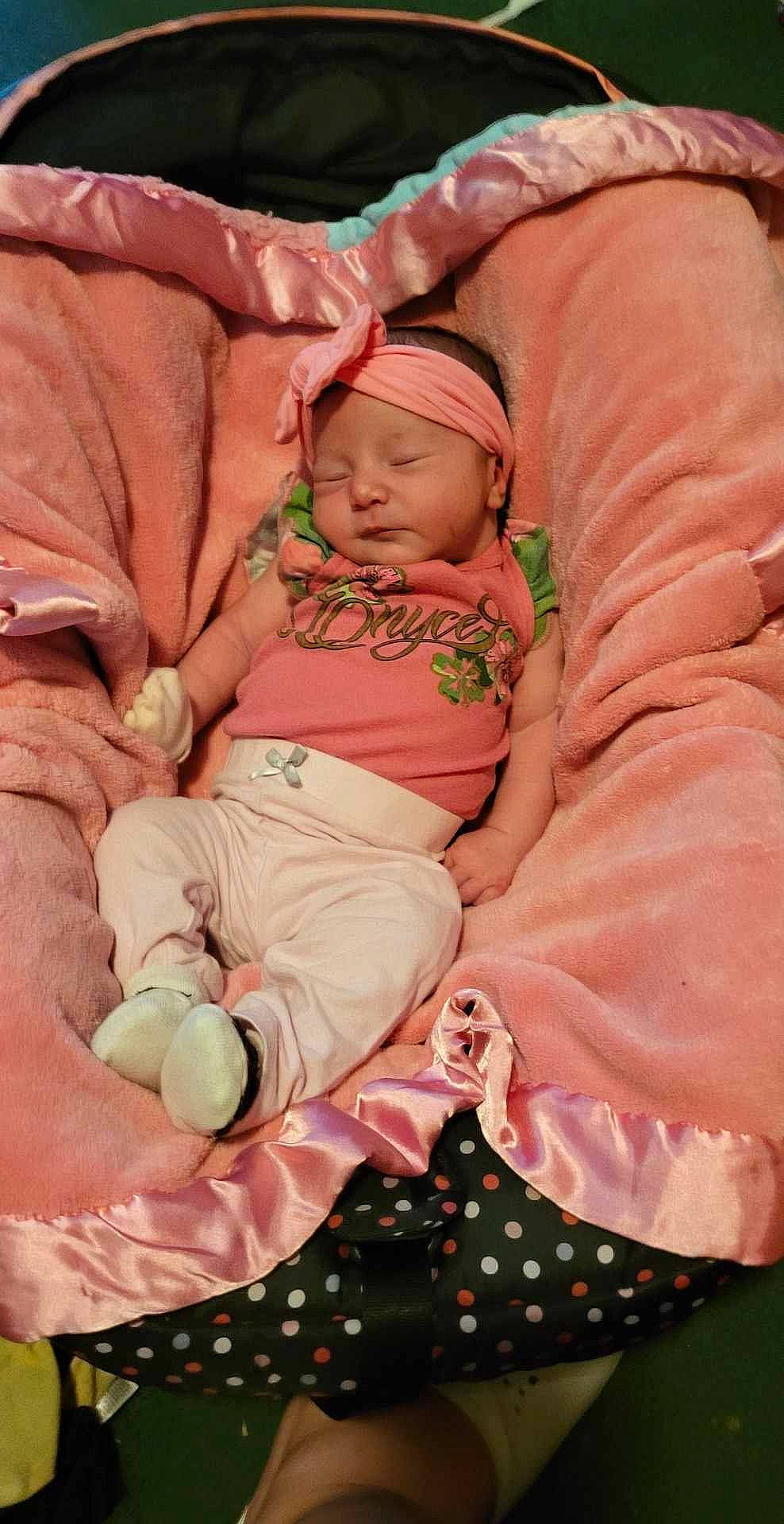 Gabriella is registered to the contest to win money with this photo: abdomen, baby, baby_products, baby_sleeping, baby_toddler_clothing, bedtime, chest, child, comfort, event, foot, headwear, lap, linens, magenta, navel, person, pink, stomach, thigh