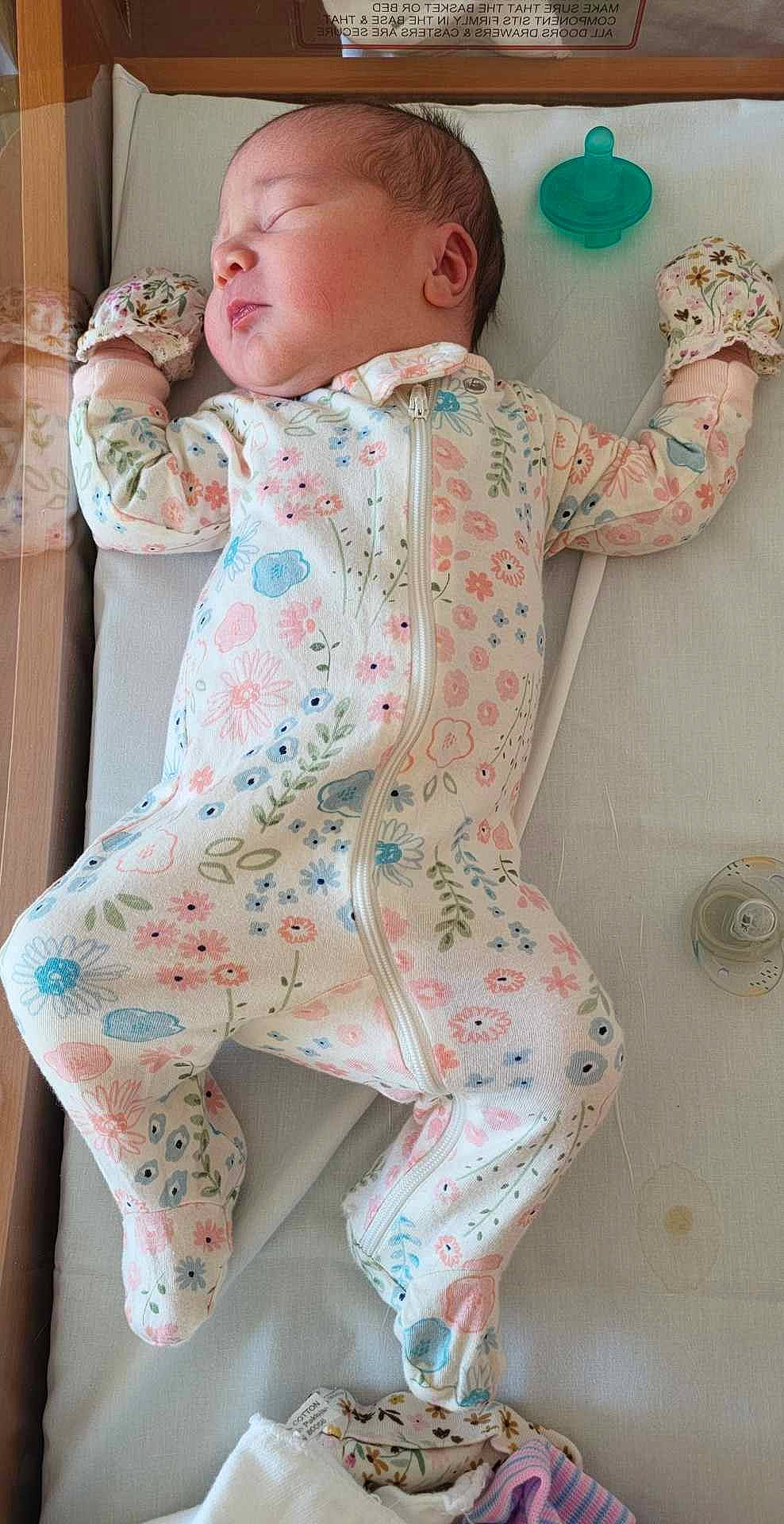 Gabriella is registered to the contest to win money with this photo: baby, baby_toddler_clothing, child, collar, comfort, dress, green, human_leg, knee, leg, linens, pattern, person, pink, product, sitting, sleeve, standing, textile, thigh
