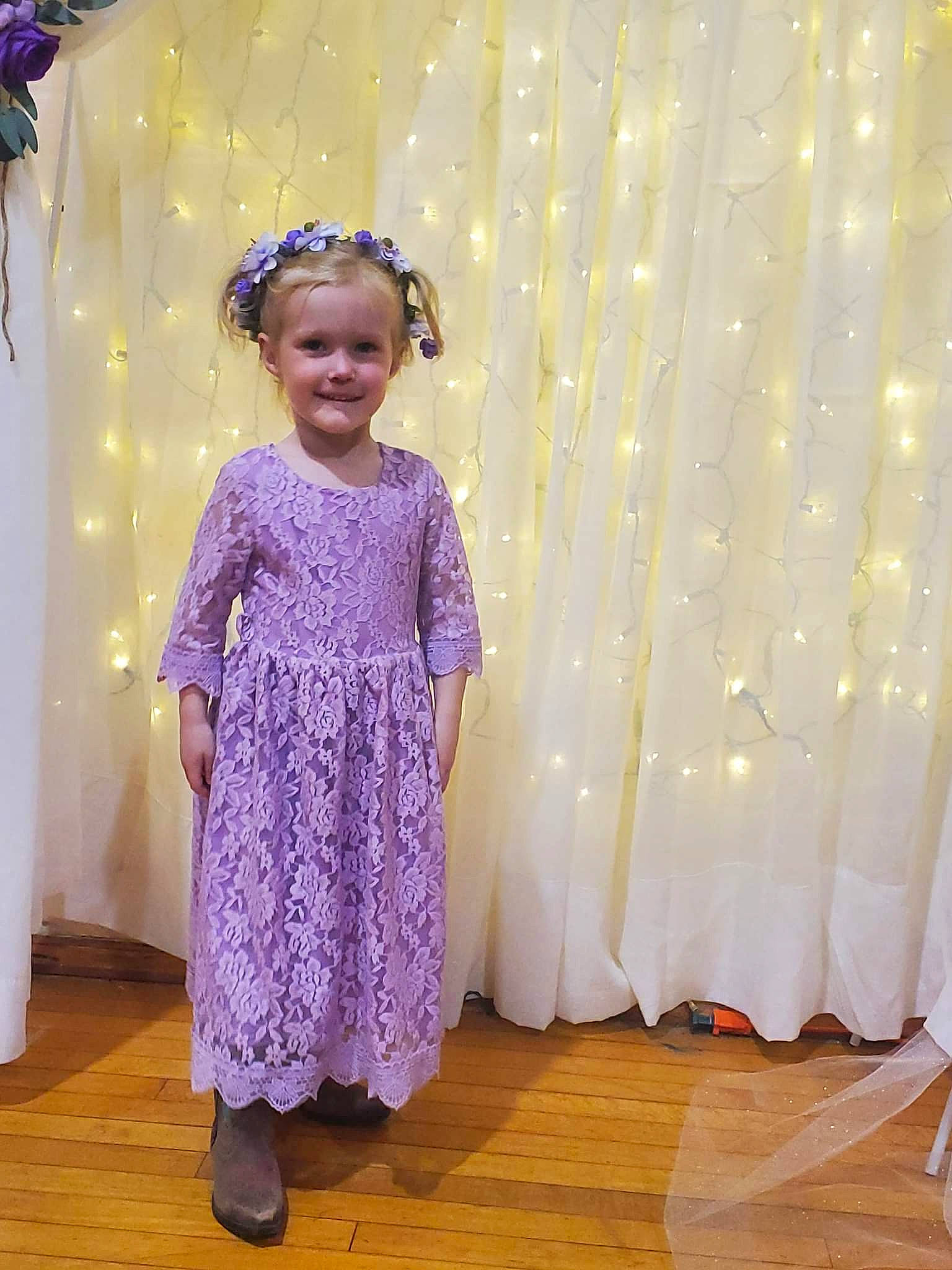Coralynn is registered to the contest to win money with this photo: baby_toddler_clothing, child, curtain, decoration, event, fashion_design, flooring, fun, happy, joy, magenta, pattern, person, pink, purple, sleeve, smile, standing, textile, toddler