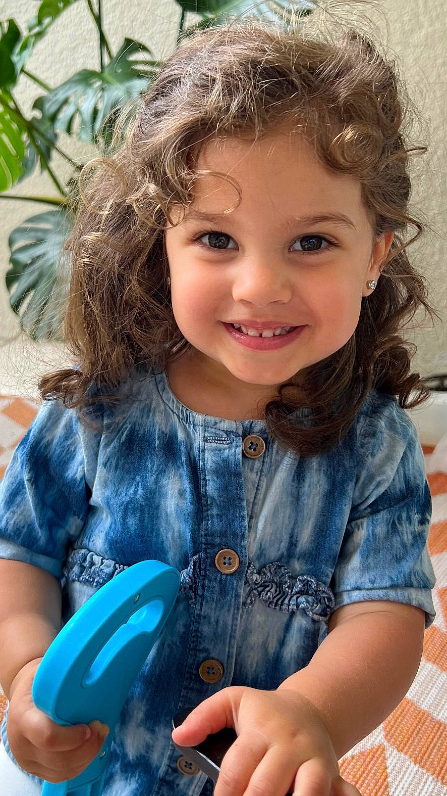 Talia is registered to the contest to win money with this photo: bodypart, child, clothing, coat, cream, cutlery, dessert, face, female, finger, food, girl, hand, happy, head, pants, person, photography, portrait, smile