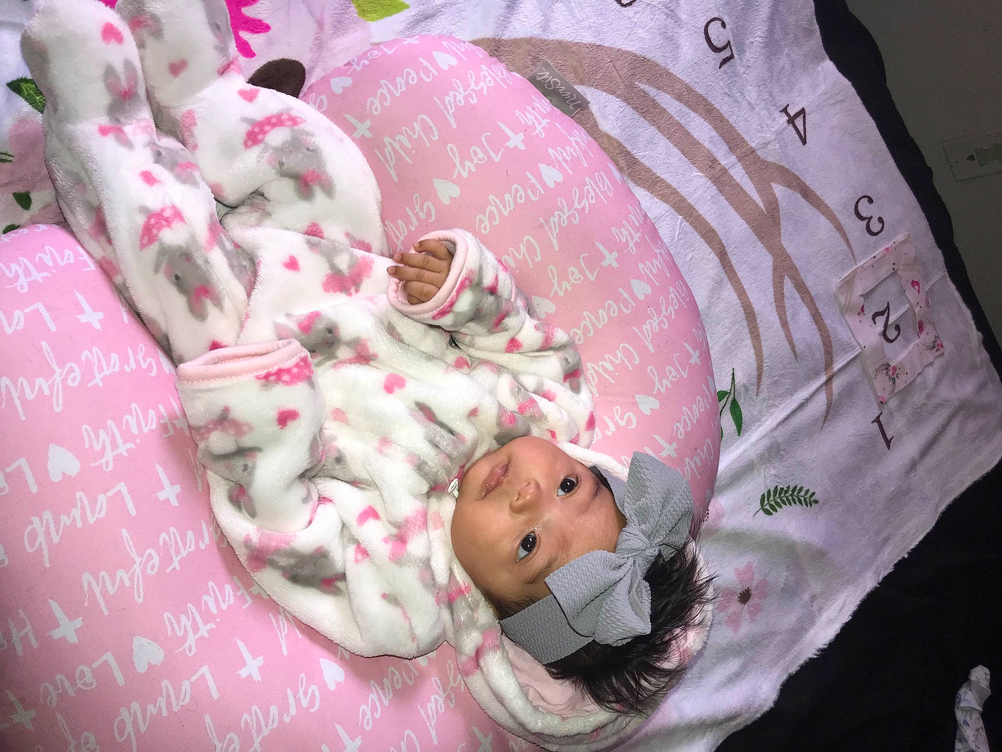 Iris is registered to the contest to win money with this photo: baby, baby_products, baby_safety, baby_sleeping, baby_toddler_clothing, bedding, bedtime, carmine, child, comfort, headwear, infant_bed, linens, magenta, pattern, people, person, pink, room, skin