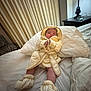 Eric is registered to the contest to win money with this photo: baby, infant, bed, blanket, booties, clothing, curtain, furniture, lamp, linens, person, portrait, rest, sleepwear, soft, toddler, warm, yellow, indoors, cozy