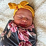 Gianna joined the competition — help win amazing prizes! baby, blanket, bow, child, cozy, cute, floral, headband, indoors, infant, newborn, peaceful, portrait, resting, sleeping, soft, texture, white, wrapped, yellow