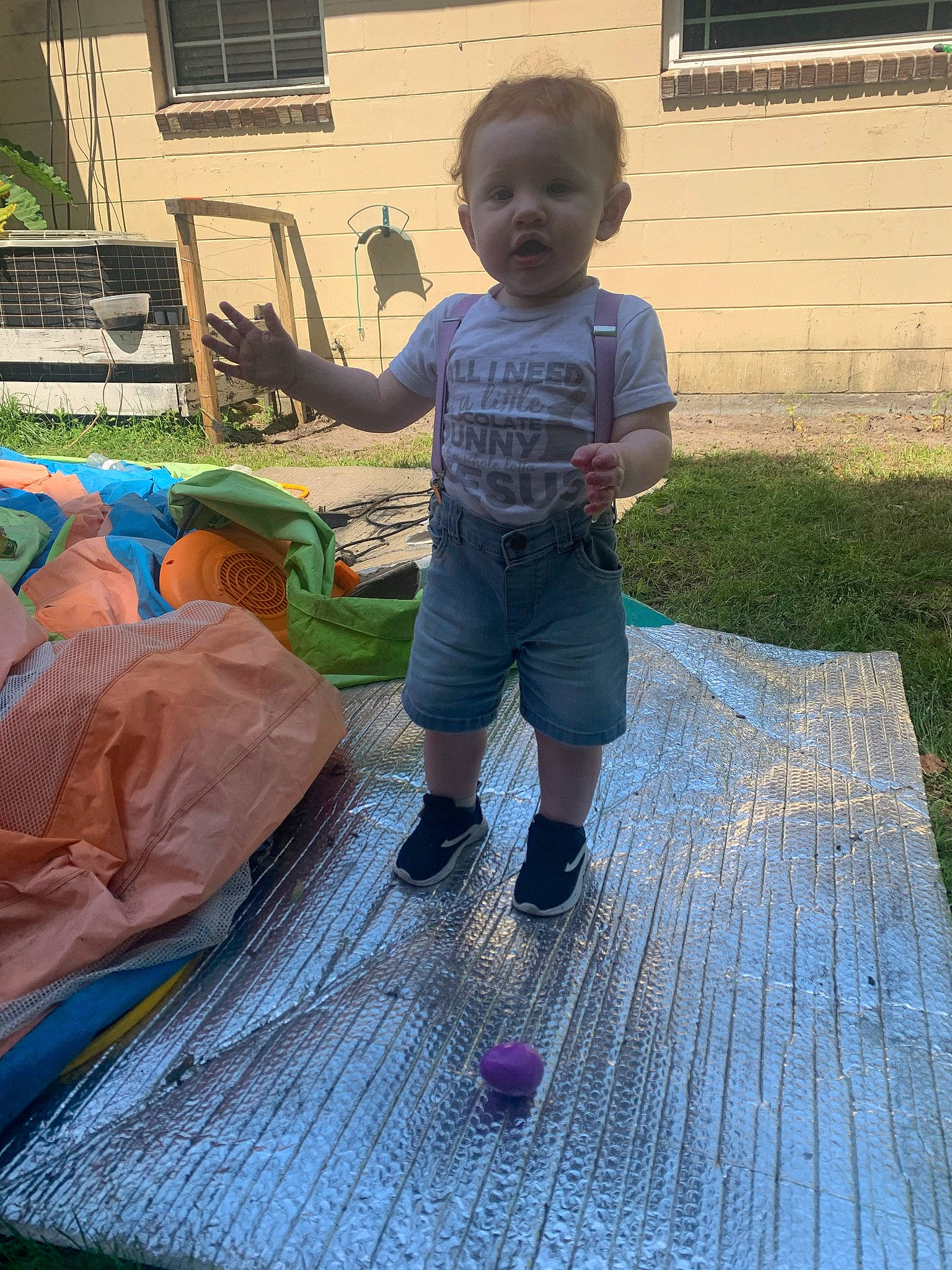 Liam joined the competition — help win amazing prizes! baby, child, flooring, fun, garden, grass, house, lawn, leisure, person, play, recreation, sandal, shorts, sitting, surprise, t_shirt, toddler, vacation, window