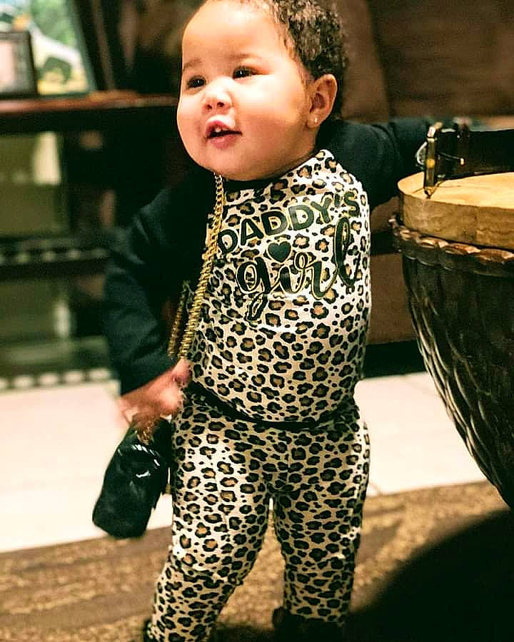 La Niya is registered to the contest to win money with this photo: baby, baby_toddler_clothing, cheek, child, flash_photography, flooring, fun, gesture, happy, military_camouflage, pattern, person, play, portrait_photography, sitting, skin, sleeve, smile, street_fashion, thumb