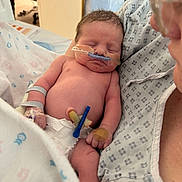 Phoebe joined the competition — help win amazing prizes! newborn, baby, hospital, medical, sleeping, infant, patient, tubes, diaper, adult, hospital_gown, bed, blanket, healthcare, care, person, closeup, medical_tape, resting, peaceful