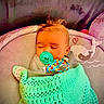 baby, infant, sleeping, pacifier, blanket, crocheted, mint_green, baby_chair, whale, heart, cozy, cute, child, face, head, indoors, comfort, resting, peaceful, toddler