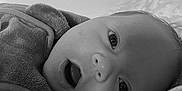 Amaël participe au concours pour gagner de l'argent avec cette photo : baby, blanket, child, closeup, cozy, cute, expression, eyes, face, head, indoors, infant, monochrome, mouth_open, newborn, portrait, resting, sleeping_area, soft, warm