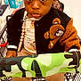 Kross is registered to the contest to win money with this photo: toddler, child, shopping_cart, store_aisle, baby_products, jacket, teddy_bear_patch, sneakers, curly_hair, brown_pants, pacifier_clip, floor, shopping, retail, clothing, person, indoor, cute, curious, black_hair