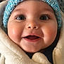 baby, child, smiling, face, headwear, hat, knitted_hat, fleece_jacket, clothing, warm, cozy, cute, portrait, closeup, happy, indoors, infant, cheeks, eyes, expression