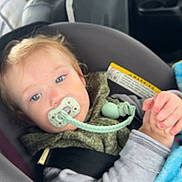 Lewis joined the competition — help win amazing prizes! child, toddler, pacifier, car_seat, blanket, blue_eyes, clothing, seatbelt, car_interior, person, baby, sitting, head, face, sleeve, hand, hair, infant, safety, driver
