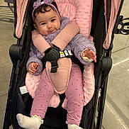 Ayla joined the competition — help win amazing prizes! baby, baby_accessories, black_stroller, child, cozy, cute, happy, headband, indoor, infant, pink_cushion, playful, polka_dot_leggings, portrait, purple_outfit, seatbelt, smiling, socks, stroller, young_child
