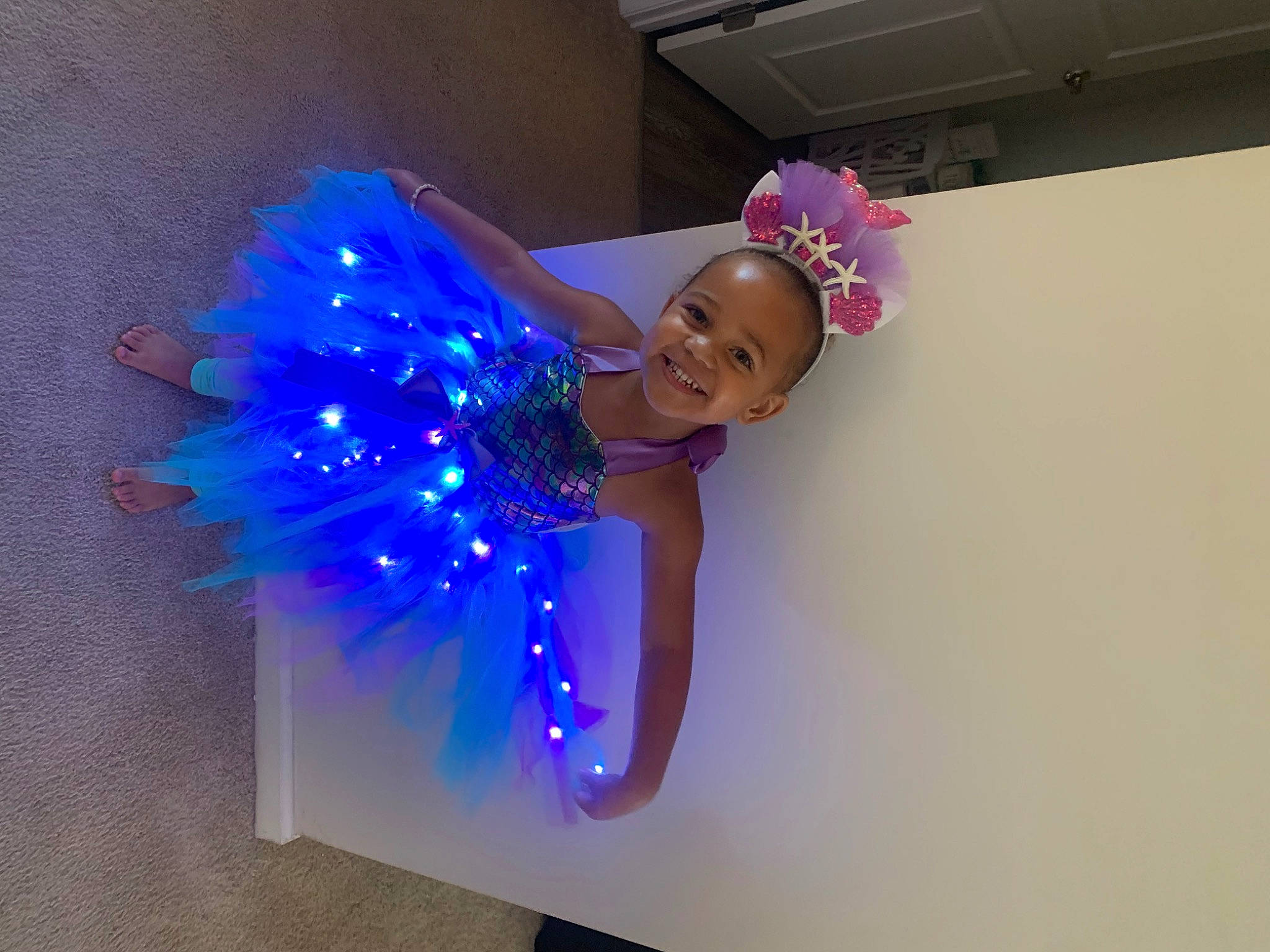 Madison joined the competition — help win amazing prizes! child, costume, costume_hat, electric_blue, entertainment, event, fashion_accessory, fun, hair_accessory, happy, headgear, headpiece, holiday, joy, magenta, party_supply, performing_arts, person, purple, smile