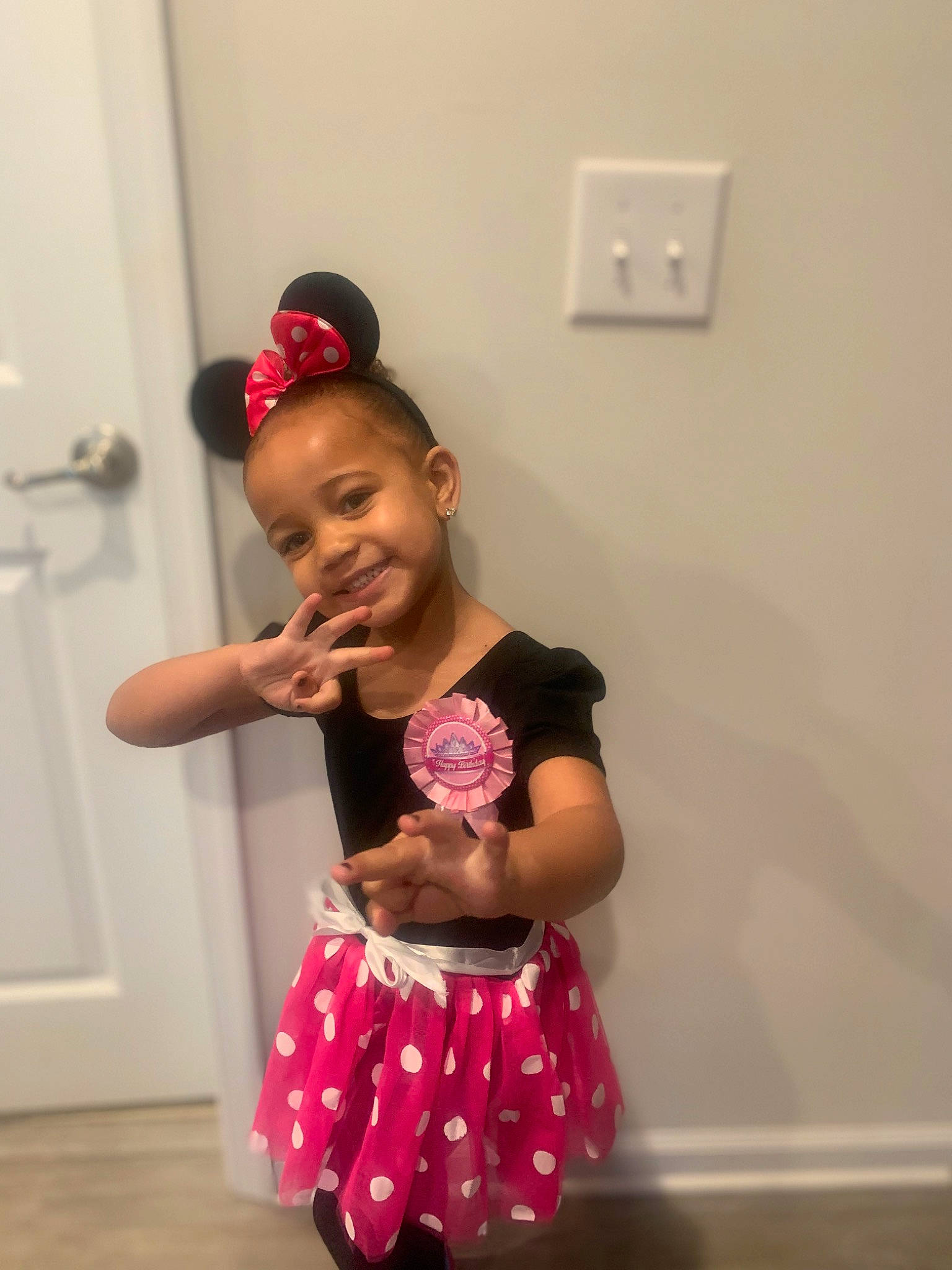 Madison is registered to the contest to win money with this photo: abdomen, baby_toddler_clothing, child, door, elbow, entertainment, event, flooring, fun, hand, happy, joint, joy, magenta, person, pink, sleeve, t_shirt, toddler, trunk