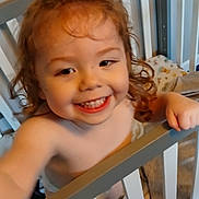 Cannon joined the competition — help win amazing prizes! toddler, child, crib, smiling, curly_hair, happy, baby, indoor, blanket, furniture, hand, person, room, playful, cute, infant, young_child, grin, bare_shoulders, reaching