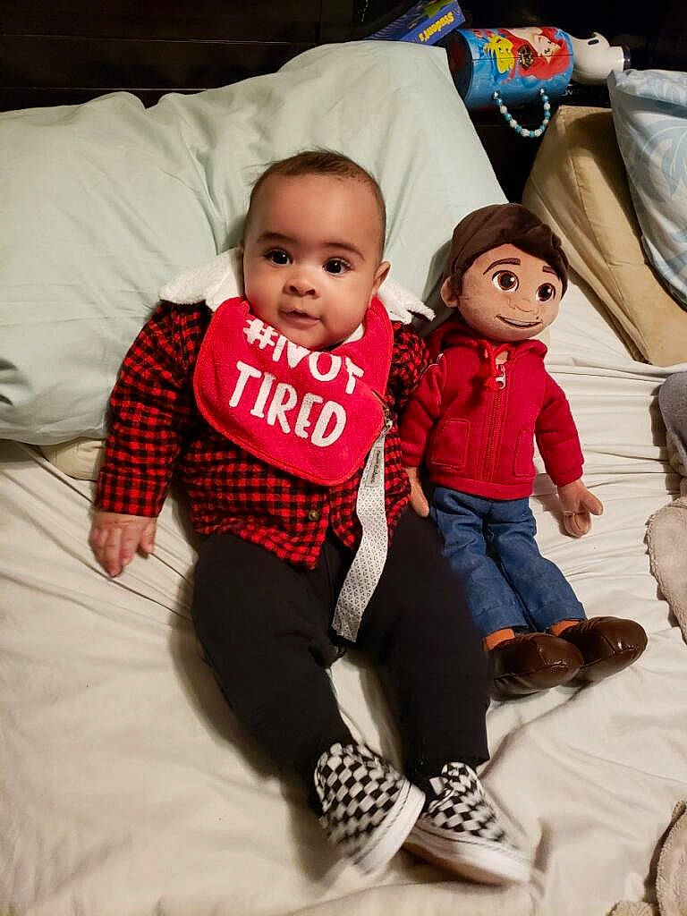 Brian joined the competition — help win amazing prizes! baby, baby_toddler_clothing, child, comfort, doll, event, flooring, fun, happy, leisure, linens, pattern, person, pillow, sitting, skin, sleeve, t_shirt, textile, toddler