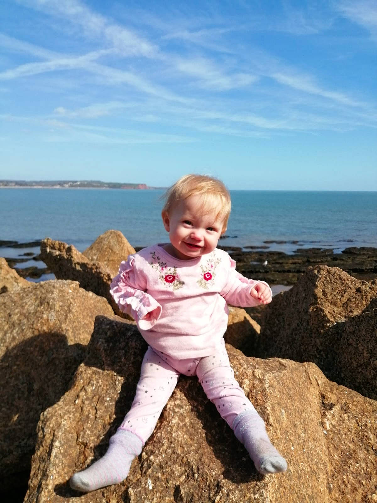 Paige Edworthy Todd is registered to the contest to win money with this photo: bay, beach, child, coast, coastal_and_oceanic_landforms, fun, happy, ocean, person, photography, pink, rock, sand, sea, shore, sky, smile, summer, toddler, tourism