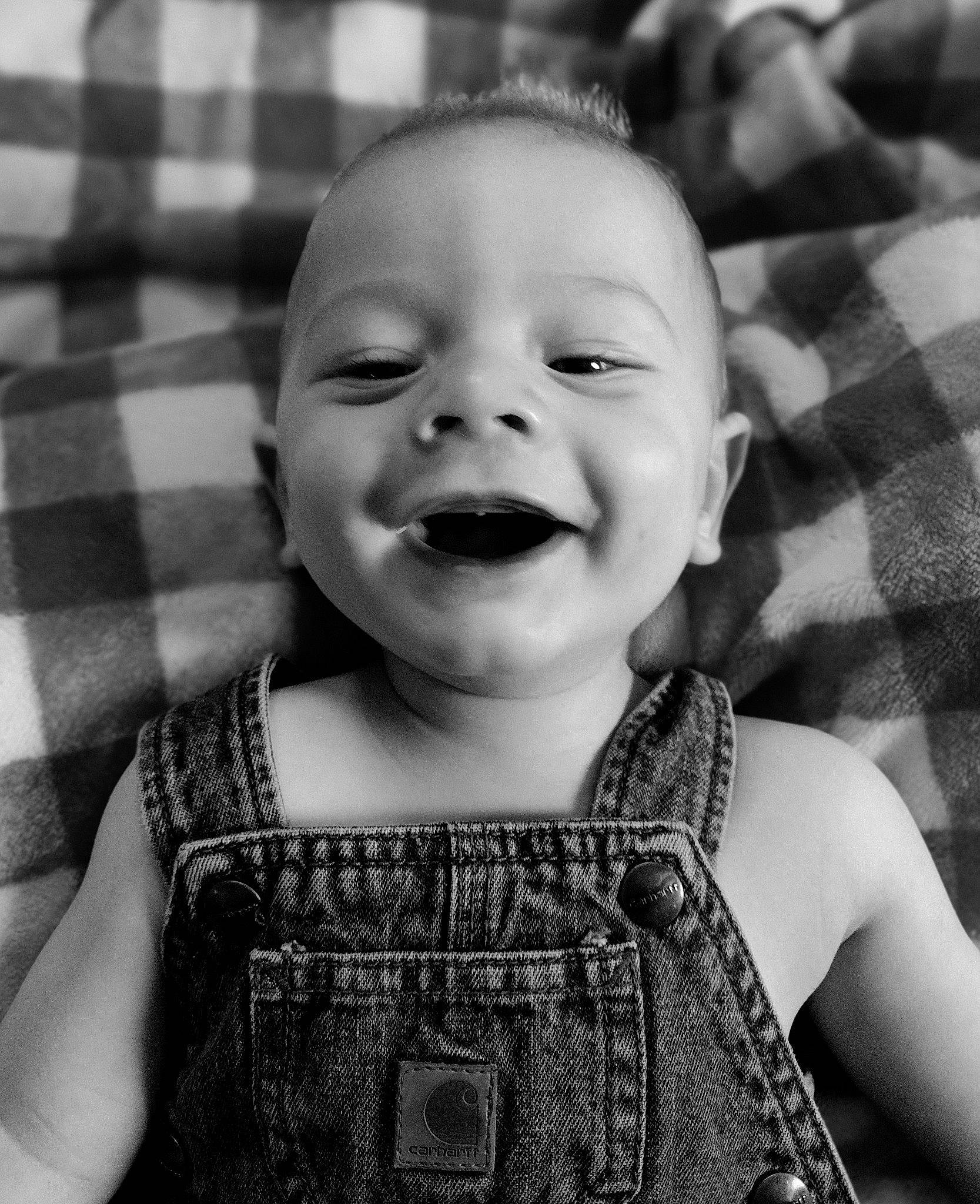Tegan joined the competition — help win amazing prizes! baby_toddler_clothing, black, cheek, clothing, eye, facial_expression, head, human, iris, lip, mouth, nose, organ, person, photograph, product, skin, sleeve, smile, standing