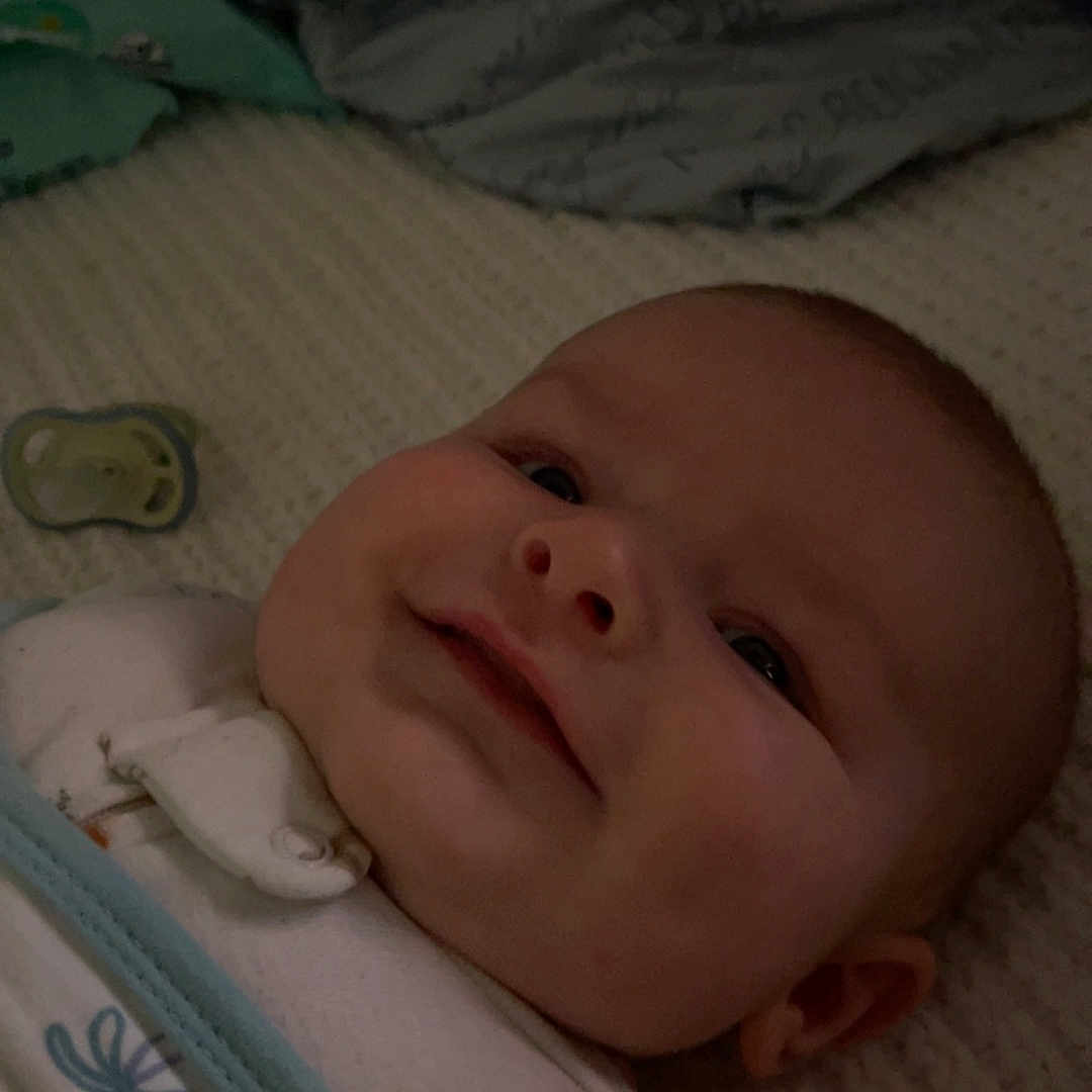 Myles is registered to the contest to win money with this photo: baby, bed, bedroom, blanket, clothing, crib, cushion, diaper, face, footwear, furniture, head, homedecor, infantbed, newborn, person, photography, portrait, quilt, shoe