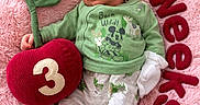 Jackie is registered to the contest to win money with this photo: baby, child, cozy, cute, green_clothing, infant, lying_down, mickey_mouse, milestone, newborn, number_3, pajamas, peaceful, pink_blanket, plush_apple, portrait, sleeping, socks, soft_texture, weeks_text