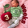 baby, newborn, sleeping, green_clothing, mickey_mouse, plush_apple, number_3, pink_blanket, soft_texture, milestone, weeks_text, infant, cute, child, portrait, cozy, lying_down, socks, pajamas, peaceful
