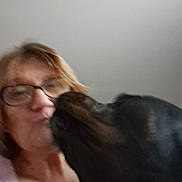 Narko participe au concours pour gagner de l'argent avec cette photo : adult, affection, animal, blur, canine, casual, closeup, companion, dog, face, friendship, glasses, head, human, indoor, interaction, kiss, love, pet, woman