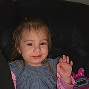 Daniela joined the competition — help win amazing prizes! toddler, child, smiling, waving, indoor, toy, cash_register, pink, blue_dress, couch, happy, face, clothing, person, young_child, playing, messy_face, furniture, casual, portrait