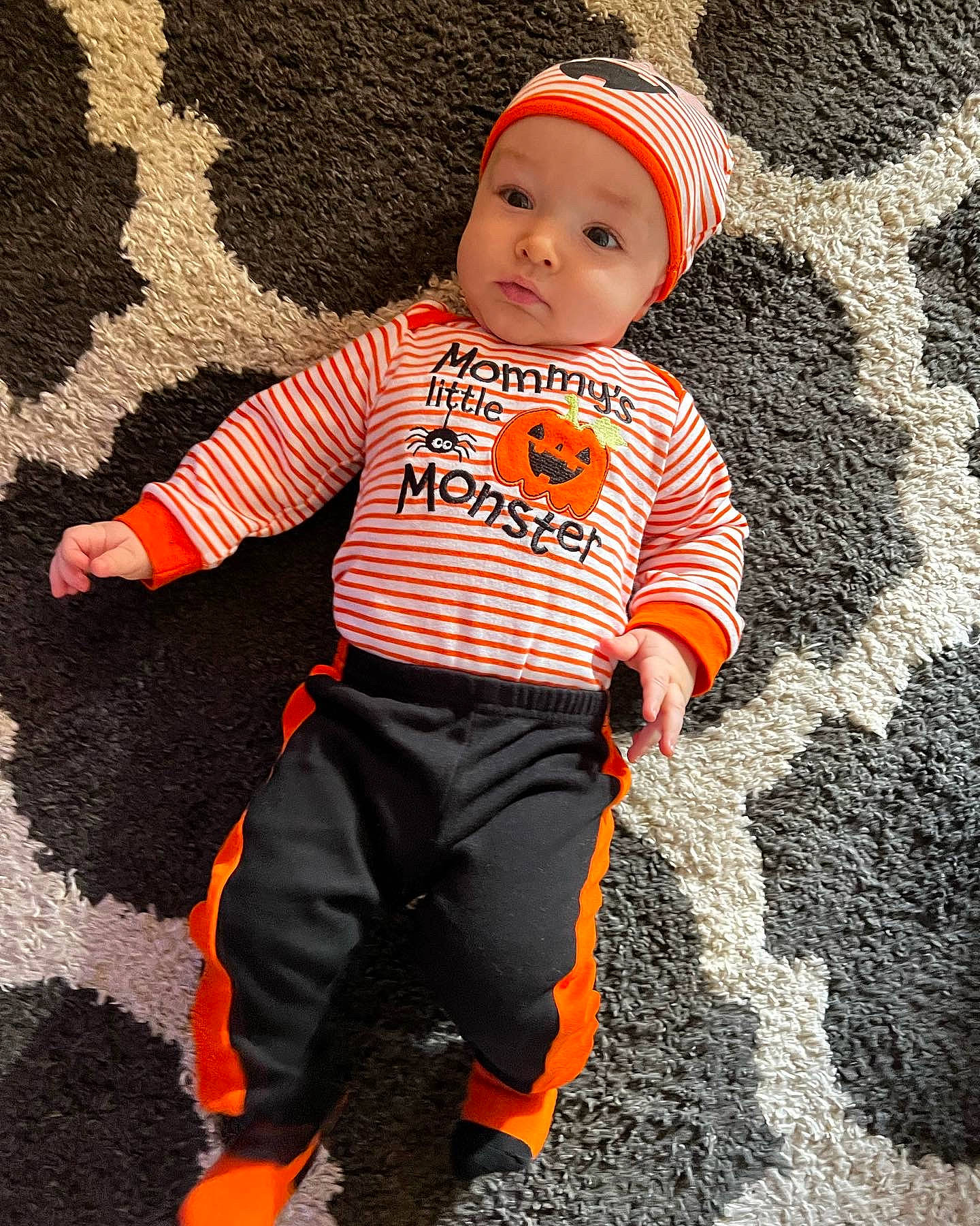 Jimmy is registered to the contest to win money with this photo: art, baby, baby_toddler_clothing, cap, child, costume, flooring, fun, happy, headwear, long_sleeved_t_shirt, orange, outerwear, pattern, people_in_nature, person, personal_protective_equipment, sleeve, sportswear, t_shirt