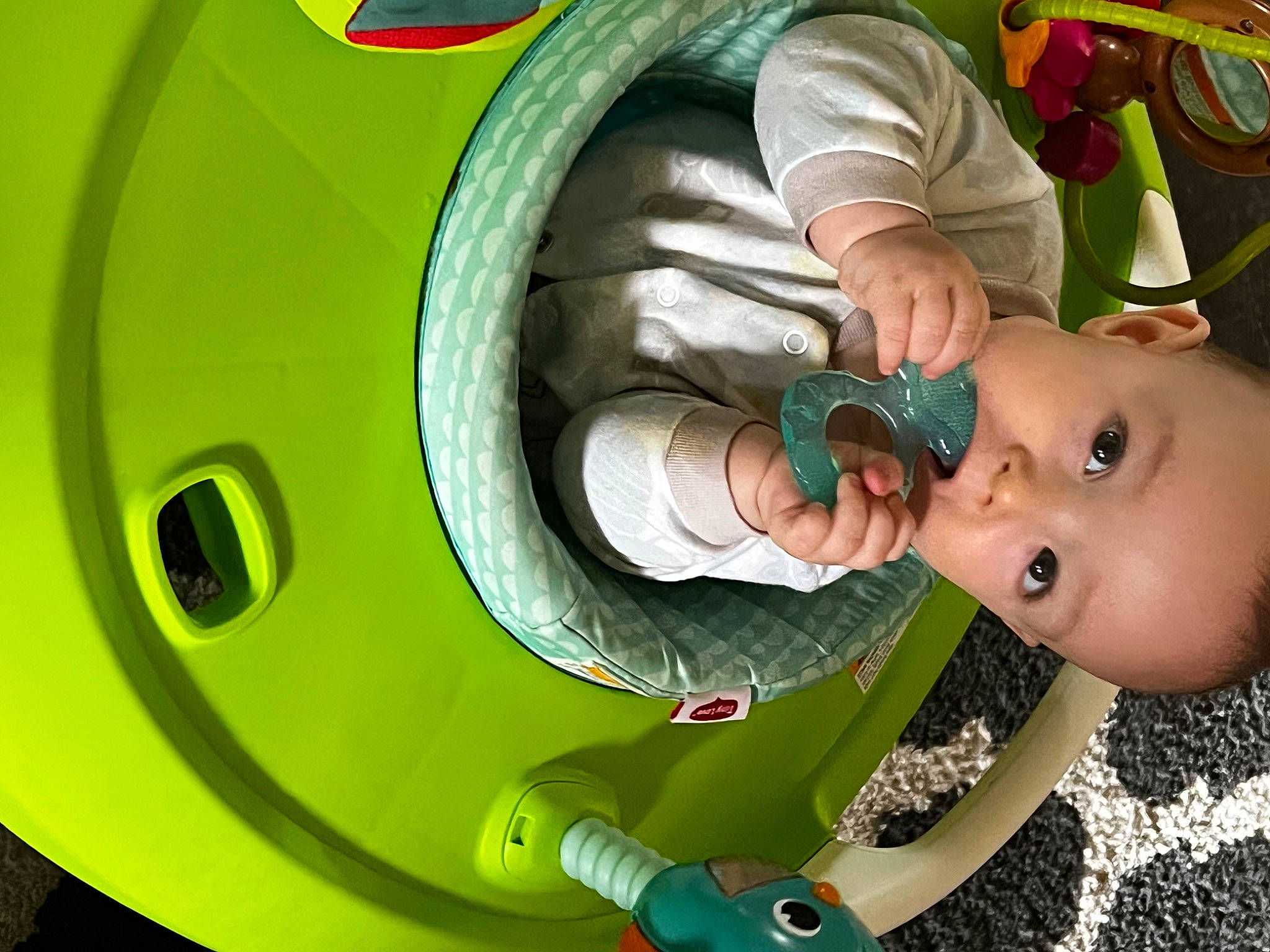 Jimmy is registered to the contest to win money with this photo: animation, auto_part, automotive_tire, automotive_wheel_system, baby, baby_products, baby_safety, baby_toddler_clothing, baby_toys, child, circle, facial_expression, fun, green, happy, machine, person, play, rim, toddler