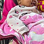Serenity is registered to the contest to win money with this photo: baby, blanket, child, clothing, cozy, cute, earrings, fabric, happy, hoodie, infant, minnie_mouse, outdoor, person, pink, portrait, seat, smiling, sweater, unicorn
