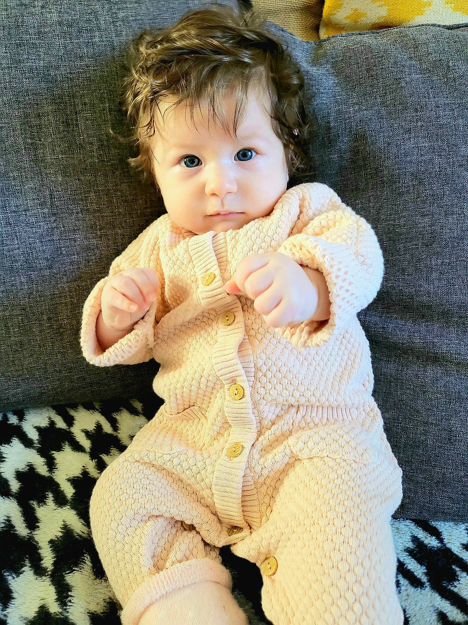 Rose participe au concours pour gagner de l'argent avec cette photo : abdomen, arm, baby, baby_toddler_clothing, cheek, child, comfort, eye, fur, gesture, hand, happy, iris, linens, pattern, person, sitting, sleeve, thumb, toddler