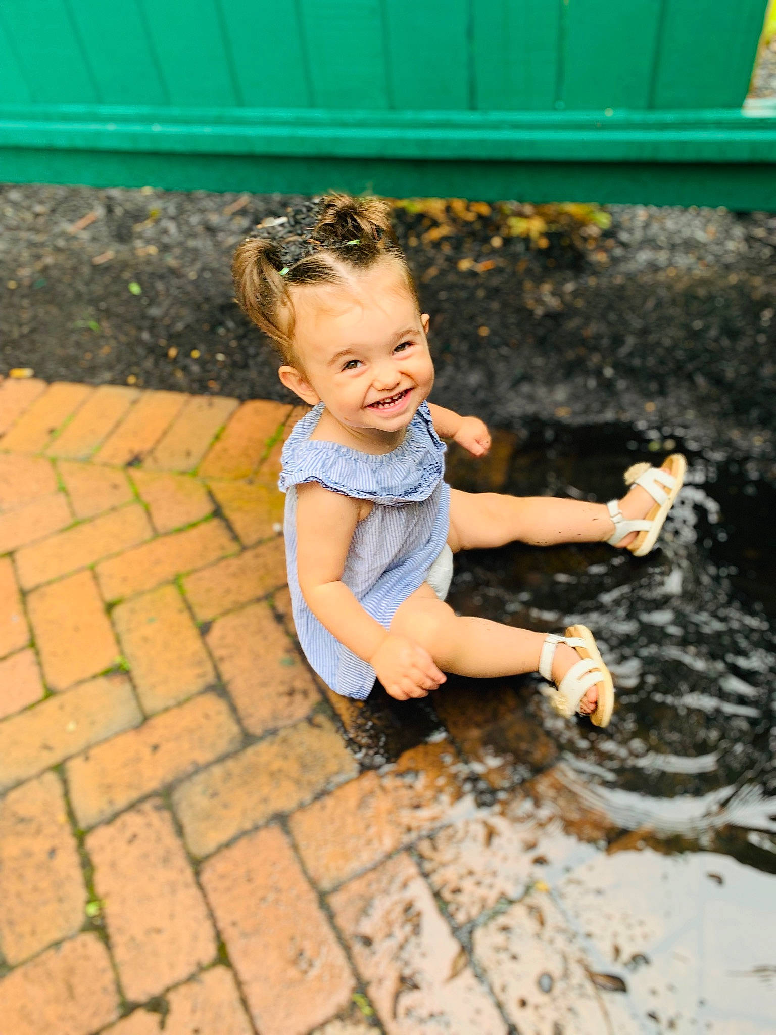 Kinsley is registered to the contest to win money with this photo: baby_toddler_clothing, child, city, flash_photography, flooring, foot, fun, grass, hand, happy, human_leg, joy, leisure, people_in_nature, person, recreation, road_surface, sitting, smile, soil