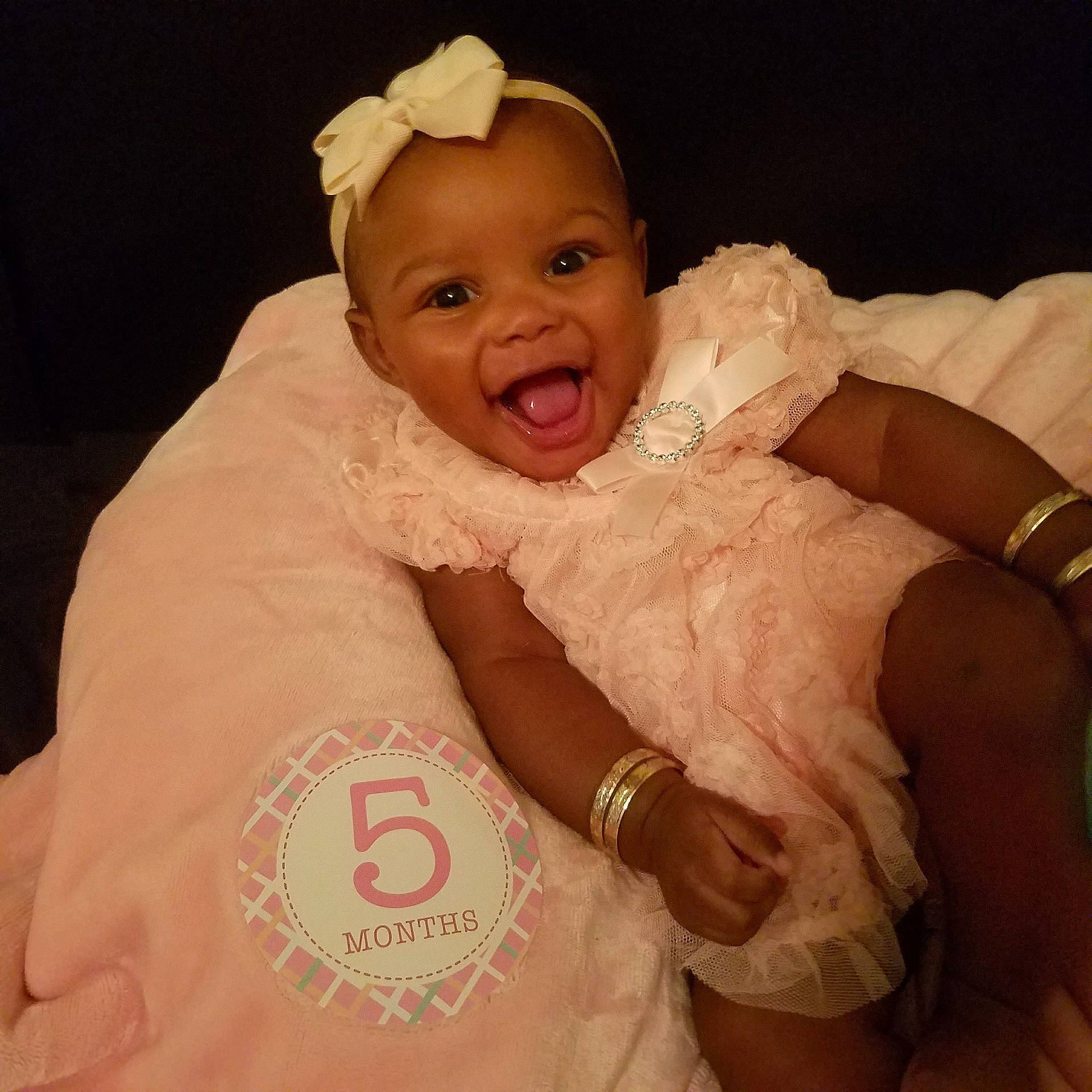 Ca'Miah is registered to the contest to win money with this photo: arm, cheek, child, finger, girl, hair_accessory, hand, head, headgear, headpiece, human_hair_color, infant, jewellery, mouth, nose, person, product, skin, smile, textile