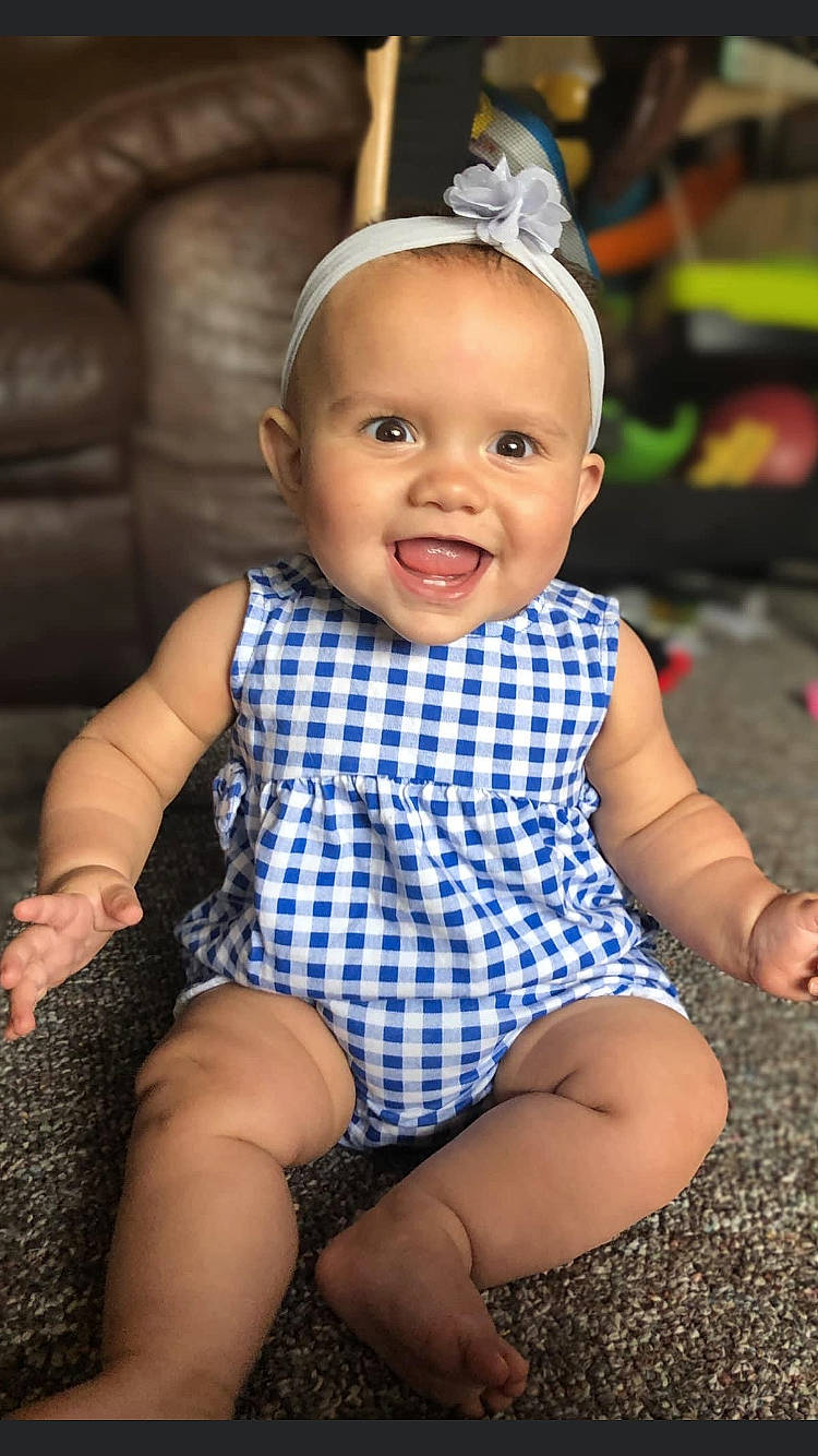 Ellianna is registered to the contest to win money with this photo: baby, baby_toddler_clothing, blue, cheek, chin, eye, face, facial_expression, finger, flash_photography, happy, head, human_body, iris, joy, organ, person, skin, sleeve, smile