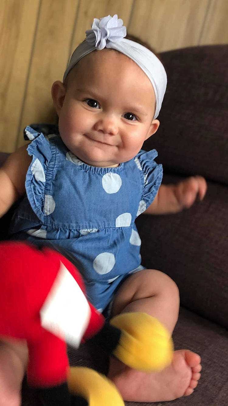 Ellianna is registered to the contest to win money with this photo: baby, baby_toddler_clothing, cheek, chin, comfort, eye, face, facial_expression, finger, head, human_body, iris, joy, leg, lip, person, pink, skin, sleeve, smile