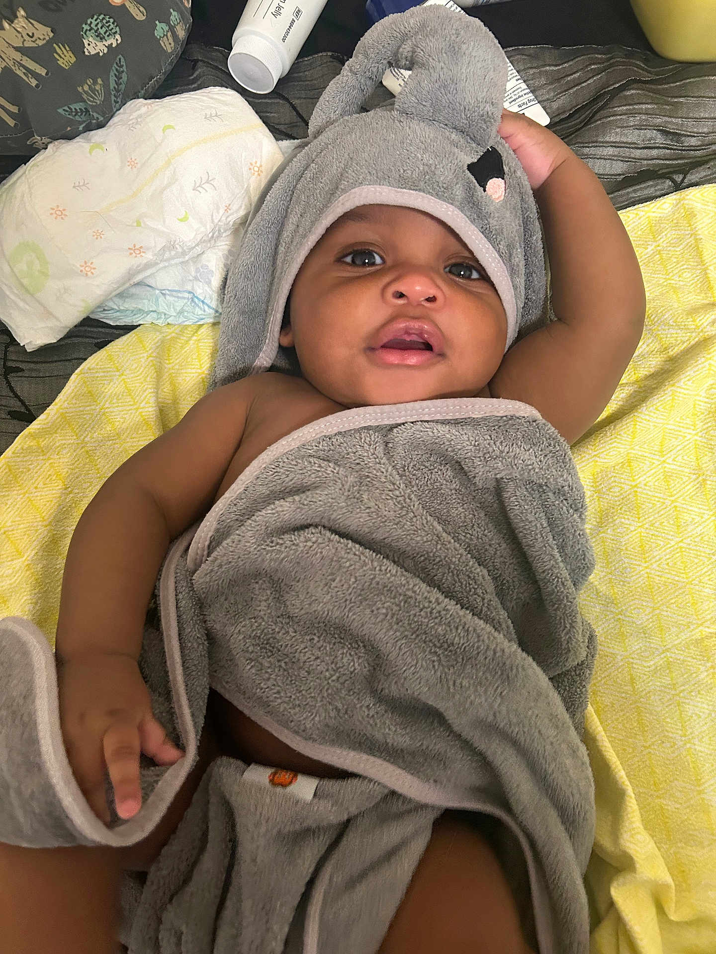 Delijah joined the competition — help win amazing prizes! baby, towel, hooded_towel, infant, blanket, skin, face, eyes, mouth, hand, diaper, baby_care, soft_texture, lying_down, indoors, child, cute, adorable, resting, baby_bath