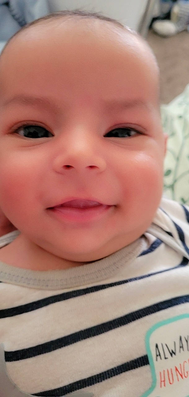 Ezekiel is registered to the contest to win money with this photo: baby, baby_toddler_clothing, cheek, child, chin, close_up, ear, eye, eyebrow, eyelash, fun, happy, iris, lip, mouth, nose, pattern, person, skin, smile