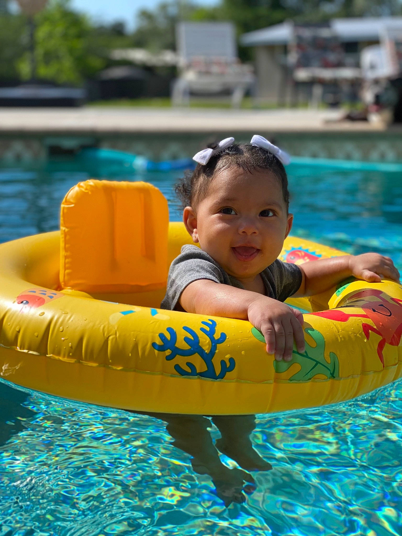 Khalani is registered to the contest to win money with this photo: baby, baby_float, bathing, child, fun, games, goggles, happy, inflatable, leisure, nonbuilding_structure, outdoor_recreation, person, personal_protective_equipment, recreation, sky, summer, swimming_pool, toddler, tubing