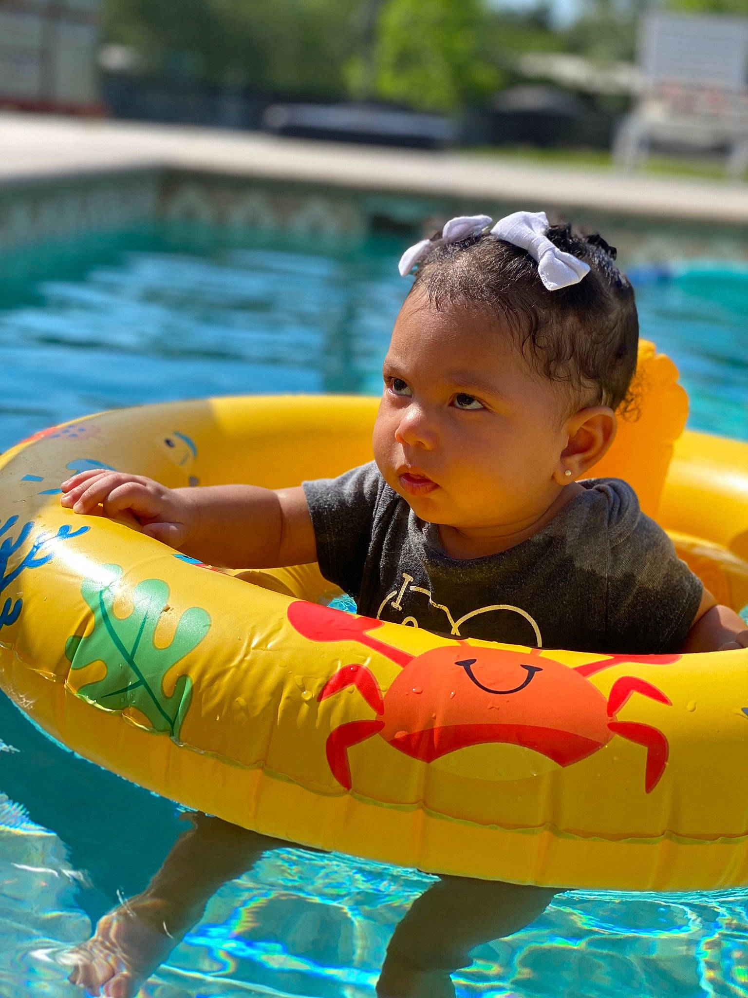 Khalani is registered to the contest to win money with this photo: baby, baby_float, baby_toddler_clothing, blue, boats_and_boating_equipment_and_supplies, child, fun, goggles, green, happy, inflatable, leisure, outdoor_recreation, person, personal_protective_equipment, recreation, swimming_pool, toddler, tubing, water