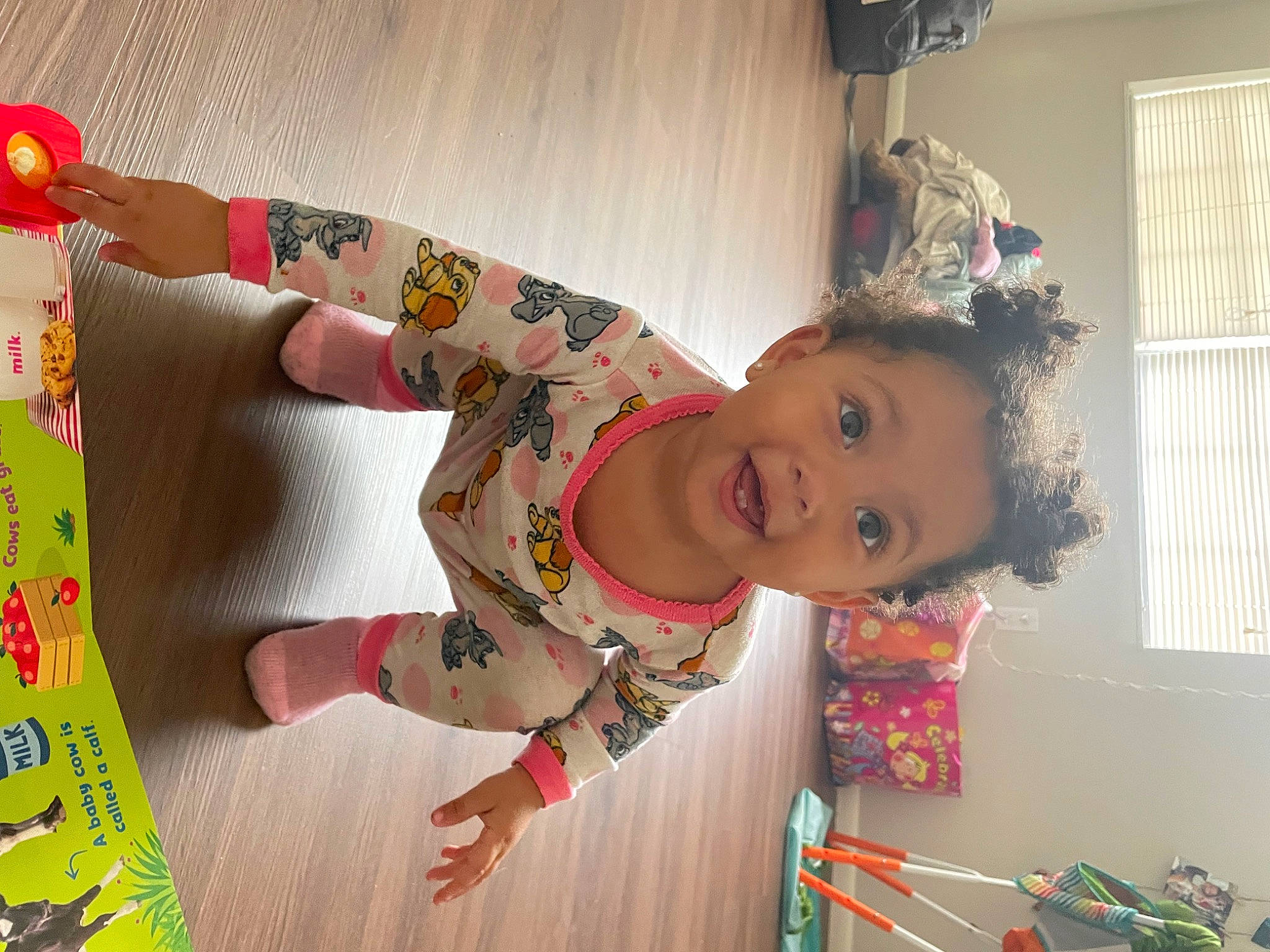 Khalani is registered to the contest to win money with this photo: baby, baby_toddler_clothing, child, costume, event, fashion_design, flooring, fun, happy, pattern, person, play, room, sleeve, smile, toddler, window_blind, wood