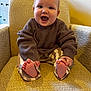 baby, child, smiling, happy, sitting, armchair, clothing, sweater, pants, barefoot, toes, indoor, furniture, cozy, texture, person, cute, infant, portrait, warm