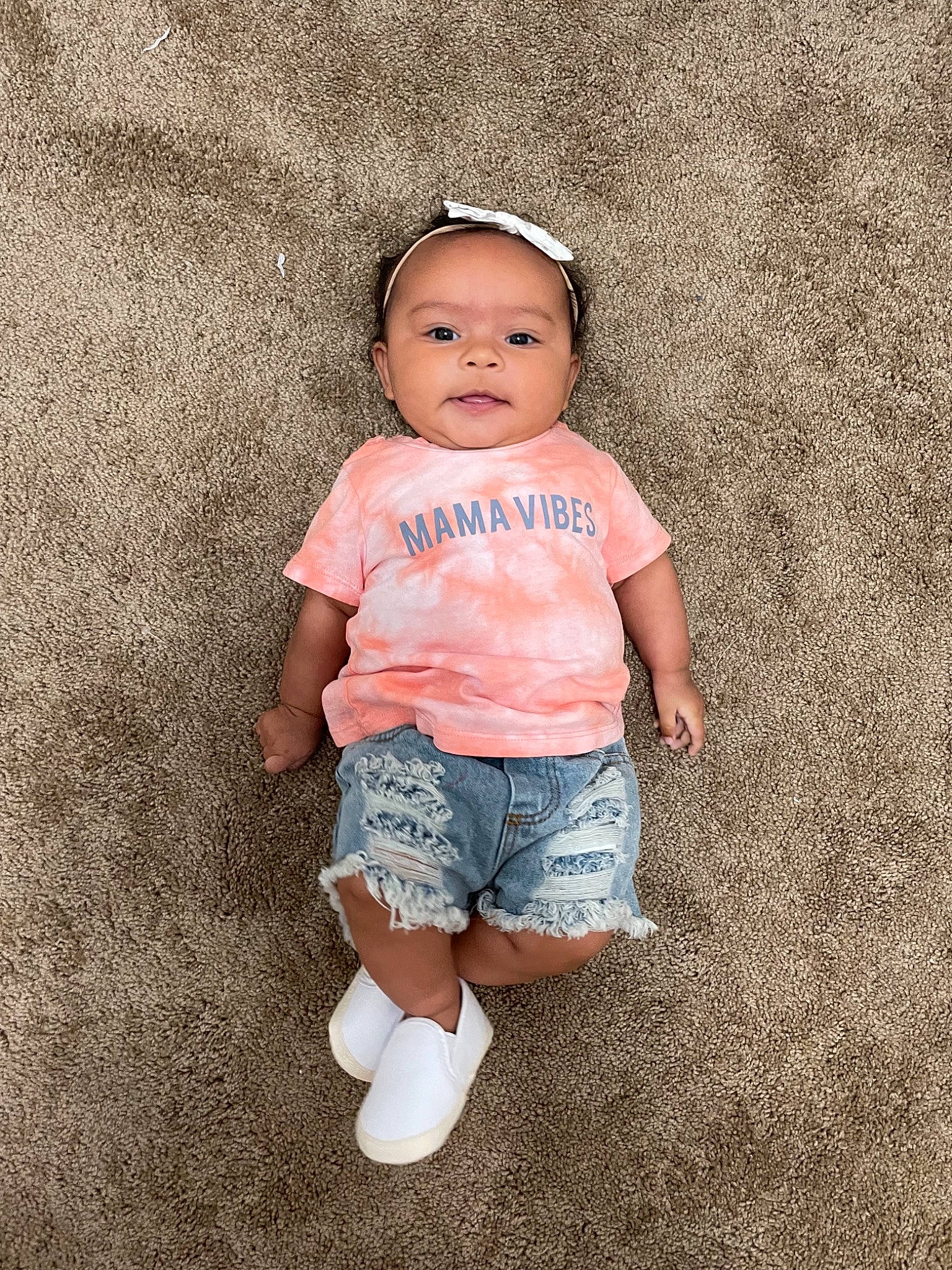 Bella Rae is registered to the contest to win money with this photo: arm, baby, baby_toddler_clothing, child, denim, face, fun, grass, happy, head, iris, jeans, pattern, person, shorts, skin, sleeve, smile, t_shirt, toddler