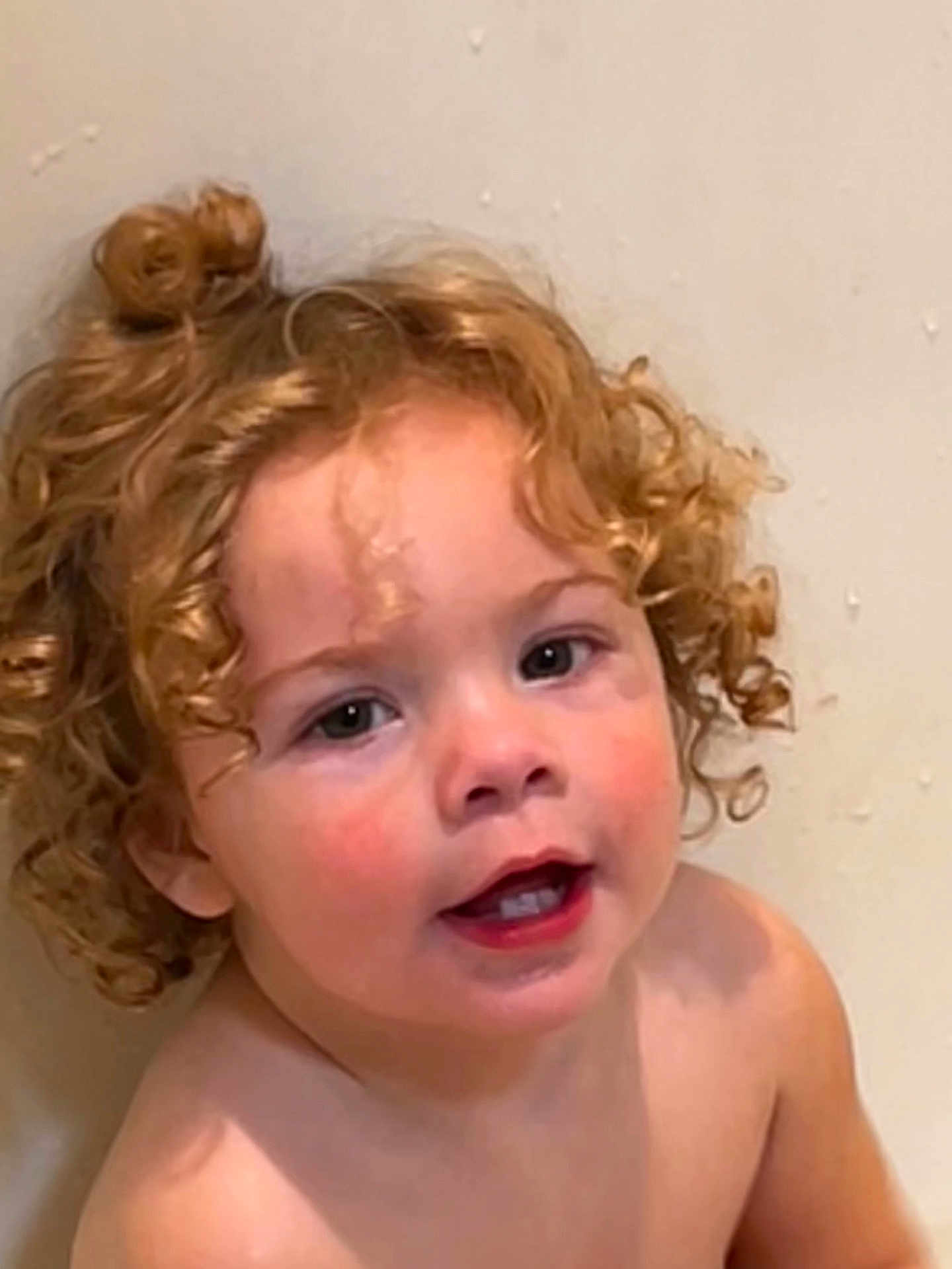Noelle joined the competition — help win amazing prizes! child, toddler, curly_hair, portrait, face, mouth_open, teeth, wet_hair, water_droplets, bathroom, shoulder, rosy_cheeks, skin, innocent, cute, close_up, eye_contact, smile, indoor, playful