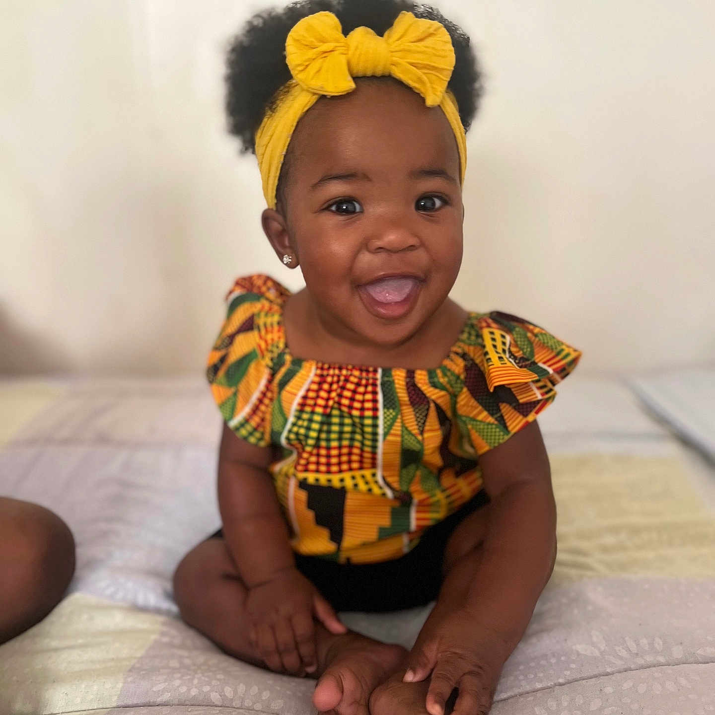 Tylondn is registered to the contest to win money with this photo: accessories, baby, babylaughing, bodypart, bracelet, clothing, dress, face, happy, head, jewelry, laughing, mouth, necklace, person, photography, portrait, sitting, smile, teeth