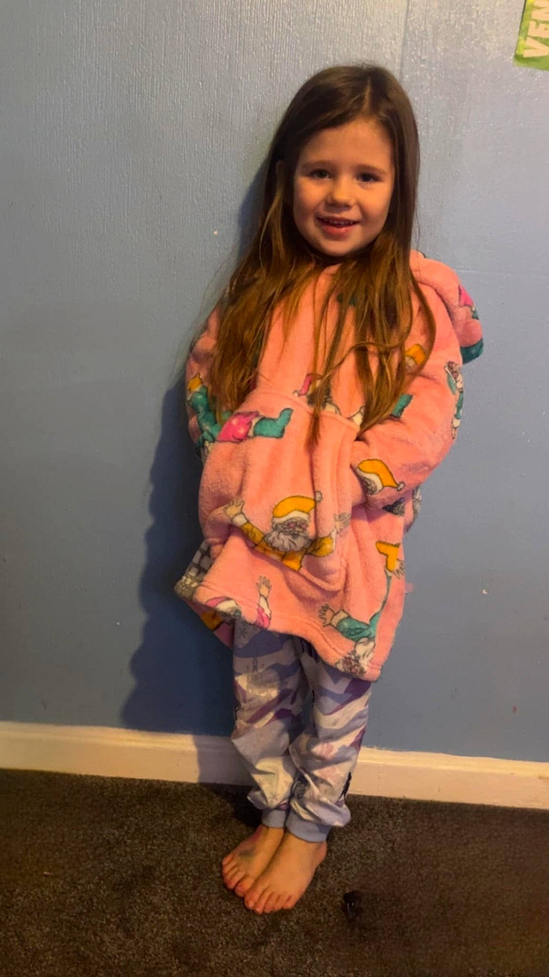 Hallie is registered to the contest to win money with this photo: child, clothing, door, dress, face, female, footwear, girl, happy, head, pajamas, pants, person, photography, portrait, purple, sandal, sleeve, smile, standing