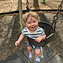 toddler, child, swing, playground, smile, curly_hair, outdoor, baby, blue_shorts, striped_shirt, socks, metal_chain, play, happiness, nature, fun, seat, person, young_child, daylight