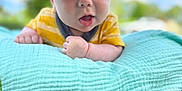 Matthew is registered to the contest to win money with this photo: baby, child, hat, yellow_shirt, blanket, grass, outdoor, sky, blue_sky, greenery, portrait, curious, wide_eyes, soft_texture, candid, sunlight, nature, infant, toddler, cute