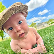 Matthew joined the competition — help win amazing prizes! baby, cap, grass, outdoor, sky, clouds, trees, house, blue_eyes, child, curious, sunny_day, nature, portrait, face, headwear, summer, greenery, closeup, infant