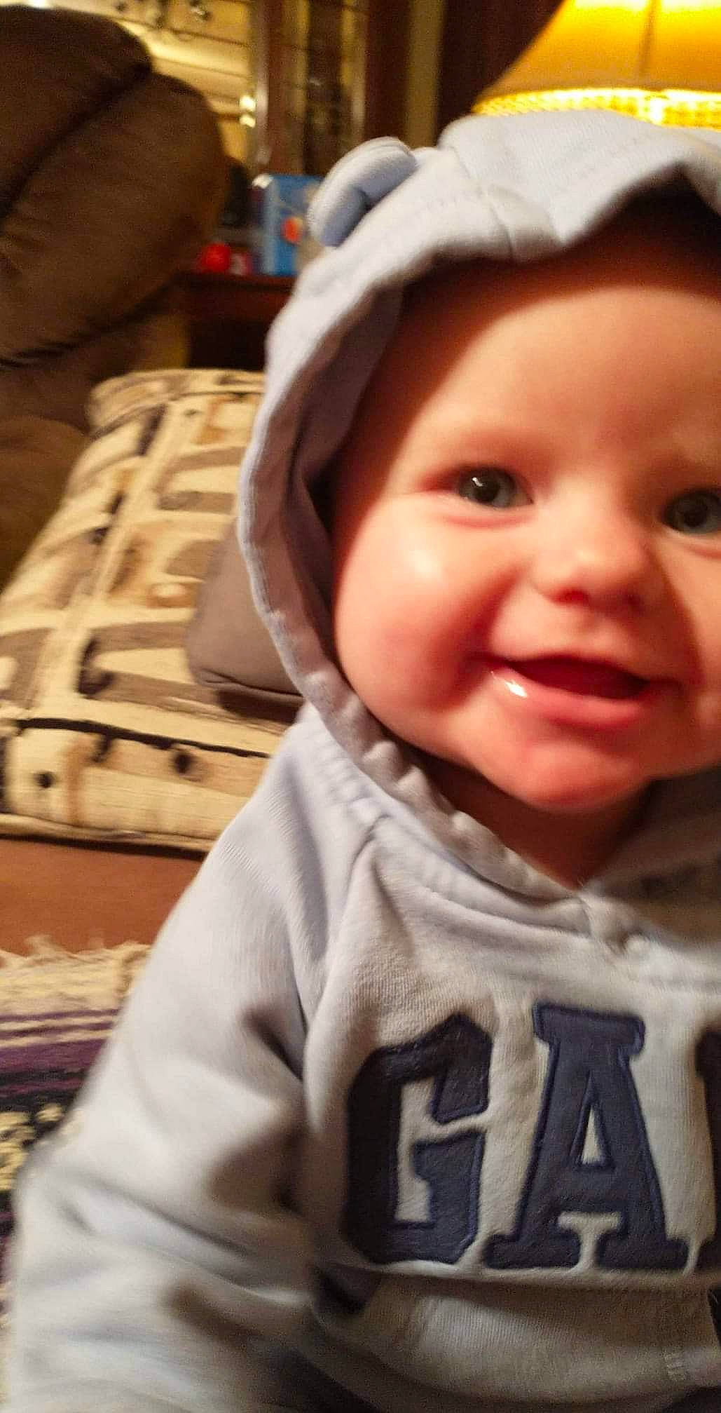 Addison Grace is registered to the contest to win money with this photo: baby, baby_laughing, baby_toddler_clothing, bag, cap, cheek, cool, eye, eyelash, facial_expression, happy, headwear, iris, joy, lip, mouth, nose, person, skin, sleeve