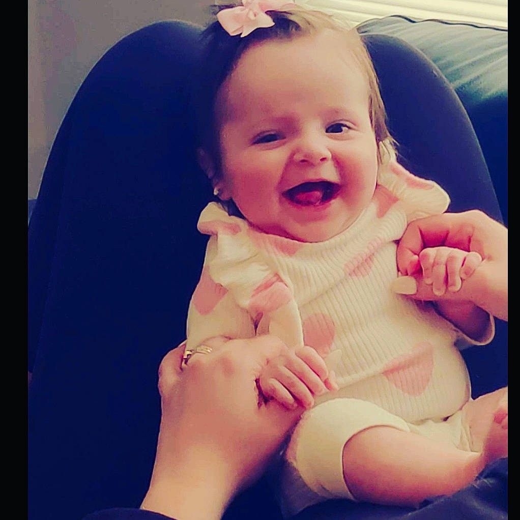 Gia is registered to the contest to win money with this photo: baby, baby_toddler_clothing, cheek, comfort, cool, ear, eyebrow, finger, gesture, hand, happy, lip, mouth, muscle, neck, nose, person, skin, sleeve, smile